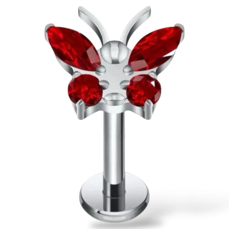 Tytanowy srebrny labret z motylkiem i cyrkoniami czerwonymi