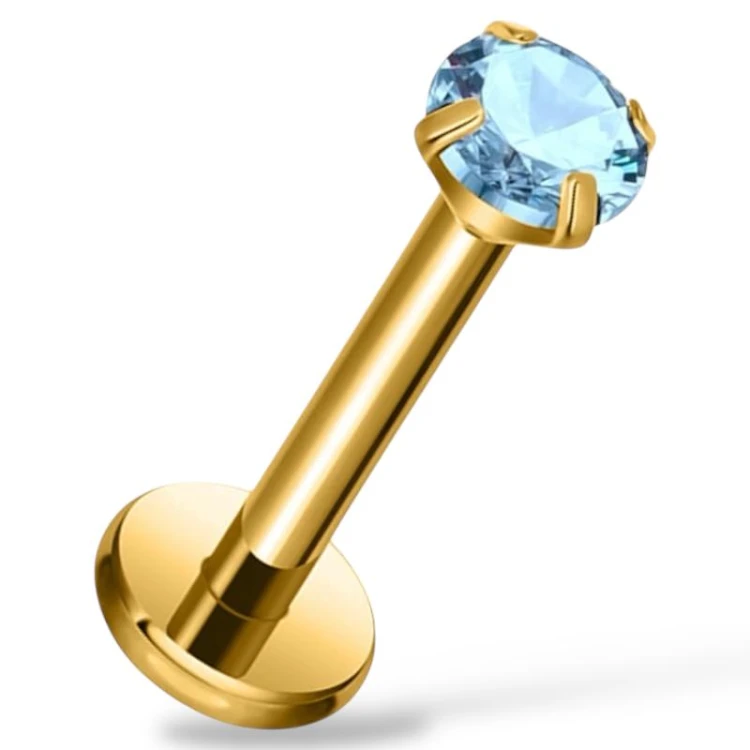 Tytanowy złoty labret z błękitną cyrkonią